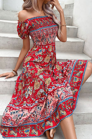 Red floral off-shoulder dress with smocked bodice and tiered skirt.