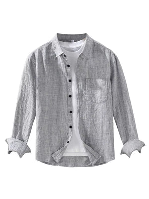 Grey linen textured long sleeve button-up shirt with chest pocket and rolled cuffs.