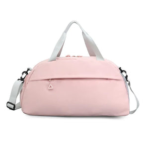 Blush pink duffel bag with detachable strap and front zip pocket.