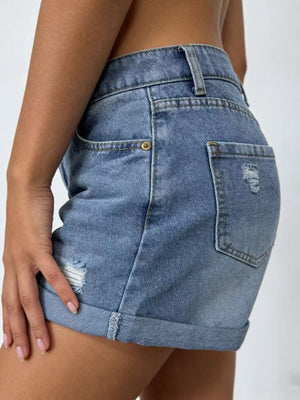 Light blue cuffed denim shorts with distressed details and high-waisted fit