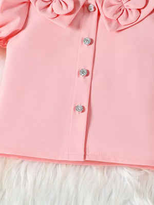 Pink toddler top with ruffle collar and jeweled buttons