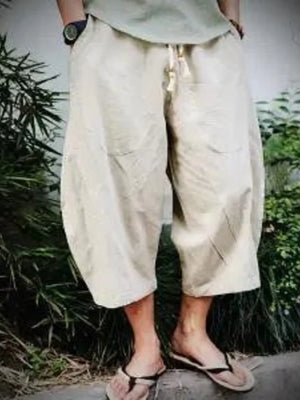 Off-white relaxed fit cropped sweatpants with drawstring waist and pockets.