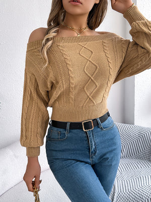Camel cable knit off-shoulder crop sweater with diamond pattern detail.