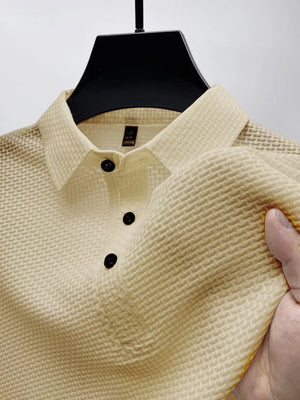 Tan textured weave polo shirt with maxi collar and black buttons.
