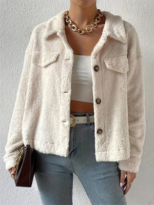 Beige teddy bear textured shacket with patch pockets and button front.