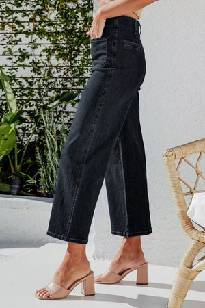 Black button-front cropped wide-leg jeans with a high waist.