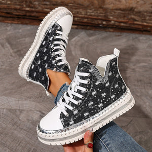Black canvas high-top sneakers with rhinestone embellishments and chunky sole.