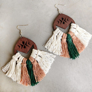 Geometric macrame tassel earrings with wood detail in white, rust, and green.