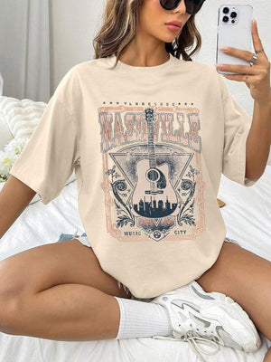 Tan oversized graphic tee with Nashville Music City guitar print