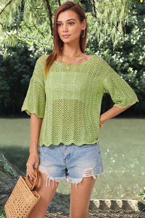 Light green open-knit top with scalloped sleeves and hem, featuring a relaxed fit and boat neckline.