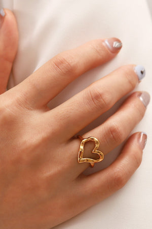 Gold sculpted heart signet ring with textured finish