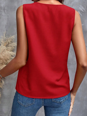 Scarlet sleeveless blouse with cascading ruffles, casual crew neck, and relaxed fit.