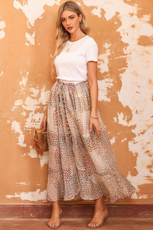 Patchwork floral maxi skirt with adjustable waist and button front, styled with a white tee.