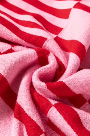 Colorblock stripe knit sweater in hot pink with red stripes and balloon sleeves.