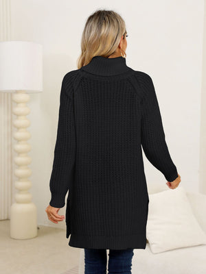 Black ribbed knit turtleneck tunic with side slits and long sleeves.