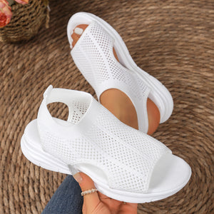 Modern mesh open-toe sandals in white with a chunky sole and breathable knit upper.