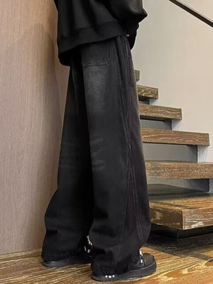 Men's black wide leg jeans with drawstring waist and casual fit.