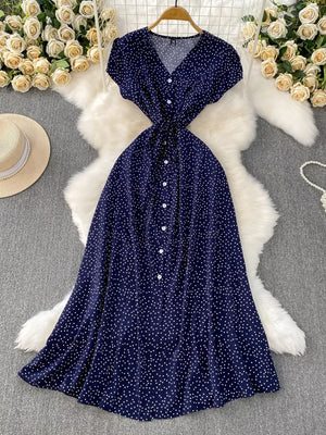 Dark blue polka dot maxi dress with belt, V-neck, short sleeves, button front.