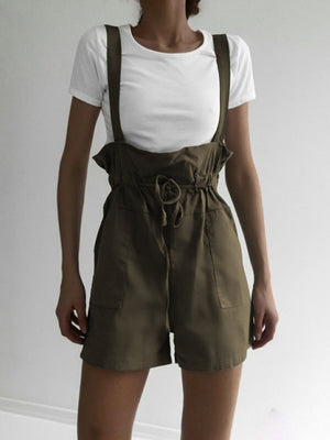 Moss high-waisted drawstring suspender shorts with pockets and a tie waist.