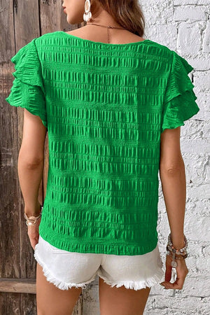 Green textured ruffle sleeve crew neck top with smocked bodice detail.