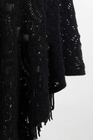 Black crochet poncho with open knit pattern and fringe detail