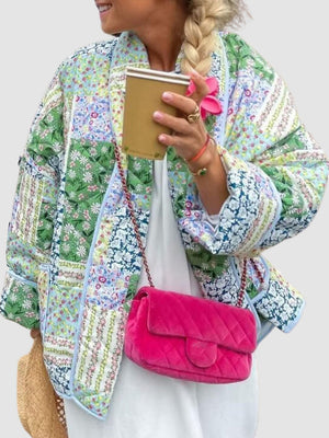 Floral quilted patchwork jacket in green and blue floral prints, with a relaxed fit.
