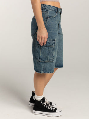 Light blue denim cargo bermuda shorts with buttoned flap pockets.