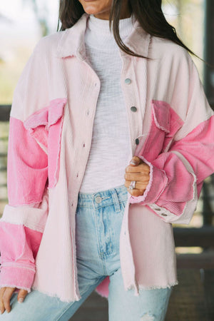 Colorblock corduroy shacket in blush pink with raw edges and button front.