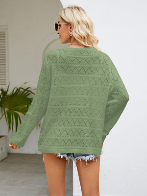 Openwork knit crewneck pullover in Gum Leaf green with diamond pattern detail.