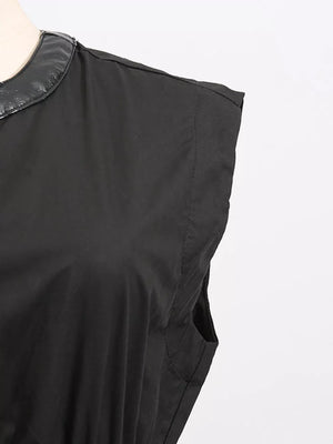 Black midi dress with faux leather collar and side pockets.