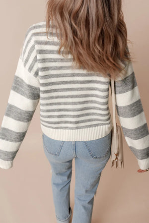 Wide Stripe Relaxed Knit sweater in acrylic blend with horizontal grey and white stripes, crew neck, and relaxed fit.