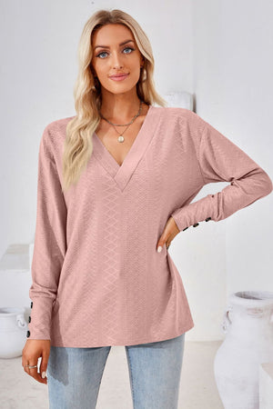 Blush pink textured v-neck long sleeve blouse with button cuffs