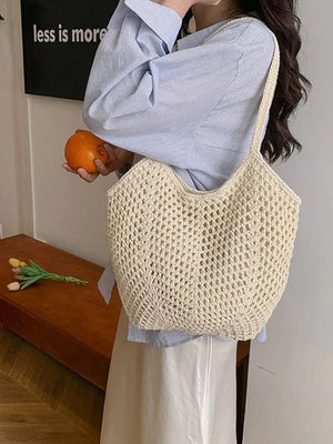 Chevron woven straw shoulder bag in rice white with braided straps and open crochet detail.