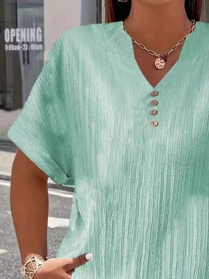Light green textured plus size V-neck t-shirt with decorative buttons and short sleeves.
