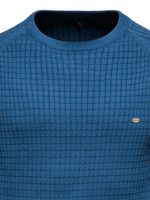 Peacock blue crewneck sweater with textured grid pattern and small oval logo detail.
