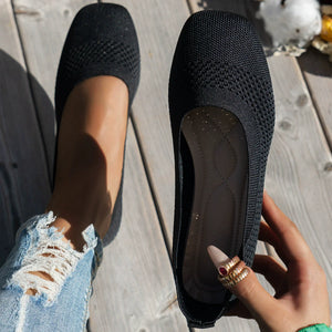 Black breathable knit square-toe flats with a textured pattern.