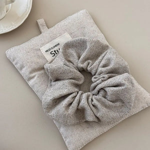 Textured knit scrunchie in Style A, soft and comfortable hair accessory.