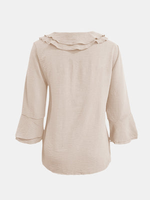 Ruffled linen blouse in Dust Storm with flared sleeves and textured fabric.