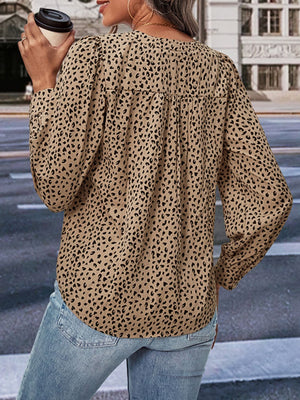Khaki leopard print v-neck blouse with gathered detail and long sleeves.