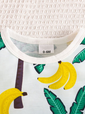 Baby set in light green cotton with tropical palm and banana print.