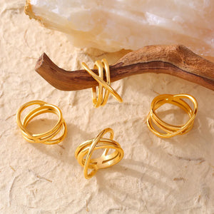 Gold intersecting band ring set with modern crisscross designs.