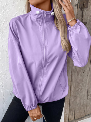 Lavender nylon bomber jacket with drawstring hem and full zip closure.