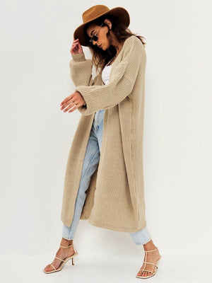 Oversized tan ribbed knit maxi cardigan with long sleeves and a relaxed fit.