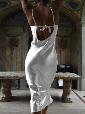 White midi dress with cowl neck and tied back detail.