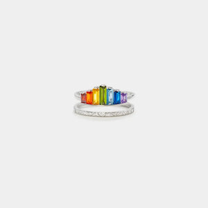 Silver stacked rings with rainbow baguette gems and geometric pattern band