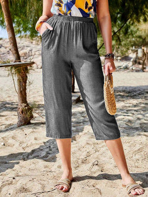 Dark gray denim cropped trousers with elastic waist and pockets