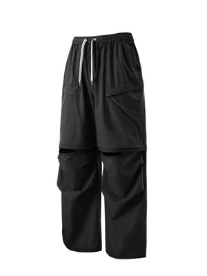 Black cargo pants with adjustable drawstring waist and zip-off legs.
