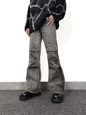 Men's relaxed fit washed flare jeans in grey denim with distressed knee details.