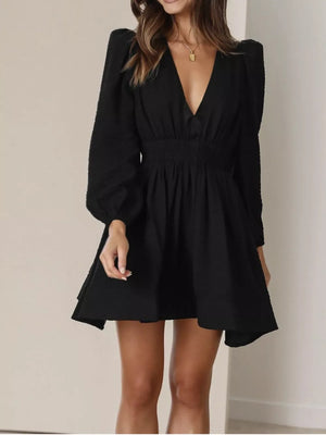 Black V-neck mini dress with puff sleeves and smocked waist