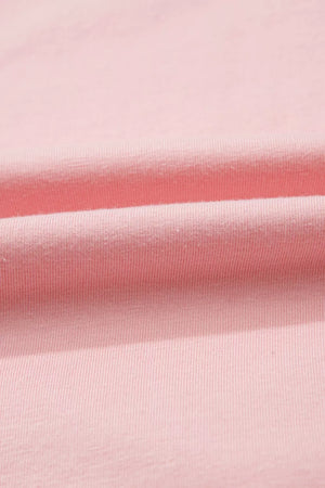 Pink cotton maternity t-shirt with subtle ribbing and soft folds.